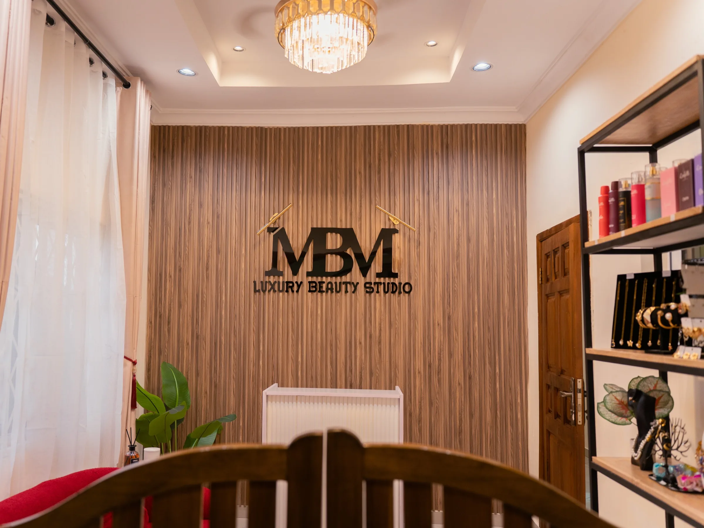 The reception area, with the studio's signage on a panelled wood wall